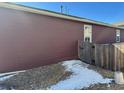 The sideyard is bordered by a wooden fence for extra privacy at 2003 Monte Vista Dr, Lochbuie, CO 80603