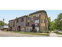 Brick and stucco building with balconies offering modern commercial and residential spaces at 2700 E Louisiana Ave # 203, Denver, CO 80210