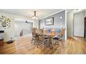 Dining room with table and seating for eight, and hardwood floors at 13080 County Road 19, Platteville, CO 80651