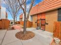 Exterior view of townhomes with a brick walkway and wooden fences at 2895 S Locust St, Denver, CO 80222