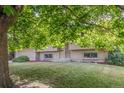 Charming home featuring a two-car garage and well-maintained front yard at 12883 E Nevada Cir, Aurora, CO 80012