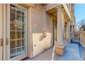 The exterior features a covered entryway with an attractive door with sidelights, stone walls, and columns at 1950 N Logan St # 102, Denver, CO 80203