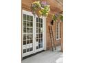 Charming entryway with a decorative ladder and vibrant flowers, perfect for adding a touch of rustic elegance at 4978 Camel Heights Rd, Evergreen, CO 80439