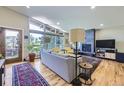 Bright living room with a modern fireplace and scenic views from large windows at 424 Peery Pkwy, Golden, CO 80403