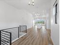 Spacious living area with stairs, showcasing sleek railings and open layout to the kitchen at 3909 Piney Grove St, Evergreen, CO 80439