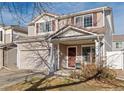 Two-story home with attached garage and landscaping at 19813 E 47Th Ave, Denver, CO 80249