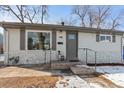 Charming single-story home with stone accents, a well-maintained yard, and inviting front entrance at 1601 S Zuni St, Denver, CO 80223