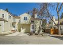 Charming two-story home featuring an attached garage and traditional siding at 12935 W 64Th Dr # D, Arvada, CO 80004