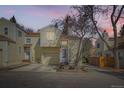Charming two-story home featuring an attached garage and traditional siding at 12935 W 64Th Dr # D, Arvada, CO 80004