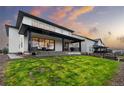 Spacious backyard with a covered patio, perfect for outdoor entertaining at 303 Rogers Ct, Castle Rock, CO 80104