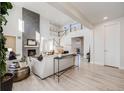 Bright living room features a fireplace and an open floor plan with high ceilings at 11303 Tango Ln, Parker, CO 80134