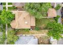 Aerial view of a home with a well-manicured backyard, surrounded by lush greenery and mature trees at 1457 S Franklin St, Denver, CO 80210