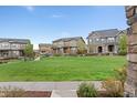 Well-maintained neighborhood with lush green spaces and inviting homes at 7602 S Yakima Ct, Aurora, CO 80016