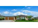 Charming single-story home with a manicured front yard, mature trees, and a welcoming entrance at 6 Wilder Ln, Littleton, CO 80123
