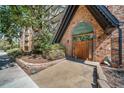 Close up of the Dublin Terrace condo entrance with brick facade and charming details at 1350 Josephine St # 508, Denver, CO 80206