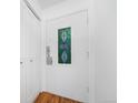 The front door has a stained glass window and hardwood floors with coat closet at 1350 Josephine St # 508, Denver, CO 80206