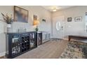 Inviting entryway featuring a stylish sideboard, decor, and convenient bench seating near the front door at 6760 Meade Cir # C, Westminster, CO 80030
