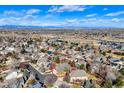 Aerial view of a suburban home showcasing neighborhood and mountain views in a well-established residential area at 823 W 126Th Pl, Westminster, CO 80234