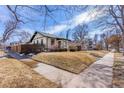 Exterior shot of home featuring a manicured lawn in a residential neighborhood at 1804 S Corona St, Denver, CO 80210