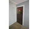 Apartment entrance featuring a decorated door with unit number at 7665 E Eastman Ave # 111A, Denver, CO 80231