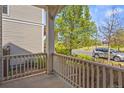 Cozy covered front porch view showing the surrounding landscape and neighborhood street at 3529 Xanthia Ct, Denver, CO 80238