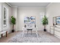 Serene home office with modern desk, neutral colors, and ample natural light at 3529 Xanthia Ct, Denver, CO 80238