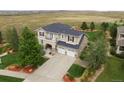 Expansive two-story home with a two-car garage, complemented by a large lot and serene surroundings at 4939 Silver Feather Cir, Broomfield, CO 80023