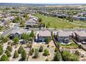 Expansive neighborhood features a beautiful home surrounded by lush greenery and open spaces at 11957 S Swift Fox Way, Parker, CO 80134