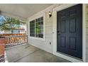 Inviting front porch showcasing the home's entry and an exterior light fixture at 1248 Button Rock Dr, Longmont, CO 80504