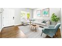 Bright living room featuring modern decor, stylish furniture, and natural light at 1248 Button Rock Dr, Longmont, CO 80504