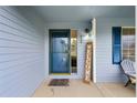 Inviting entryway with a 'Welcome' sign and charming details at 650 Olympia Ave, Longmont, CO 80504