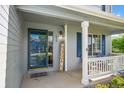 Inviting front porch with a 'Welcome' sign, offering a cozy spot to relax and enjoy the neighborhood at 650 Olympia Ave, Longmont, CO 80504