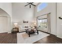 Bright living room featuring tall ceilings, large windows, and stylish decor at 650 Olympia Ave, Longmont, CO 80504