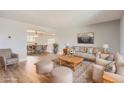 Bright living room with hardwood floors, neutral paint, and modern furnishings at 5876 W Canyon Ave, Littleton, CO 80128