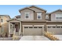 Charming two-story home boasts a two-car garage and welcoming front porch with fresh, neutral paint at 9012 Borrowdale Ln, Parker, CO 80134