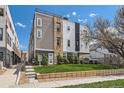 Modern townhouse with a well-manicured lawn and contemporary architectural design at 1840 Irving St, Denver, CO 80204