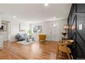 Inviting living room features hardwood floors, a large window, and stylish furnishings perfect for relaxing or entertaining at 1709 Wabash St, Denver, CO 80220