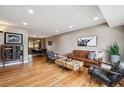 Bright living area with hardwood floors, dining area, and comfortable seating at 12752 W Asbury Pl, Lakewood, CO 80228