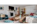 Cozy living room with fireplace, comfortable seating, and natural light in a nicely decorated home at 1050 N Lafayette St # 408, Denver, CO 80218