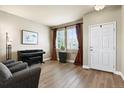 Inviting living room with ample natural light, stylish curtains, and a refined ambiance at 11007 Meadowvale Cir, Highlands Ranch, CO 80130
