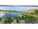 Breathtaking aerial view showcases the community lake and nearby residences at 6296 W Prentice Ave, Littleton, CO 80123