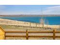 Scenic view of the lake and skyline, perfect for enjoying the natural beauty of the location at 16568 W 92Nd Pl, Arvada, CO 80007