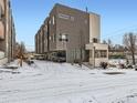 Contemporary home featuring private garage, modern architectural style and snow covered driveway at 1246 Xavier St, Denver, CO 80204