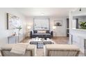 Bright living room featuring contemporary decor, plush seating, and stylish accents creating an inviting atmosphere at 1476 W Dakota Ave, Denver, CO 80223