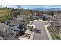 Aerial view of homes showcasing the neighborhood and distant mountain views at 6726 Taft Cir, Arvada, CO 80004