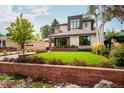 Well manicured lawn and landscaping complement this home's modern design at 111 S Hudson St, Denver, CO 80246