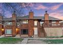 Beautiful townhouse exterior with wood siding and an inviting entryway at 1272 S Crystal Way, Aurora, CO 80012