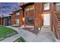 Townhouse with brown wooden shingle siding, red trim, and an inviting front entrance at 1272 S Crystal Way, Aurora, CO 80012