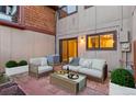 Private brick patio with comfortable seating, perfect for outdoor relaxation and entertaining at 1272 S Crystal Way, Aurora, CO 80012