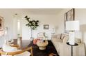 Inviting living room featuring modern décor, comfortable seating, and a stylish rug over hardwood floors at 4420 W 27Th Ave, Denver, CO 80212